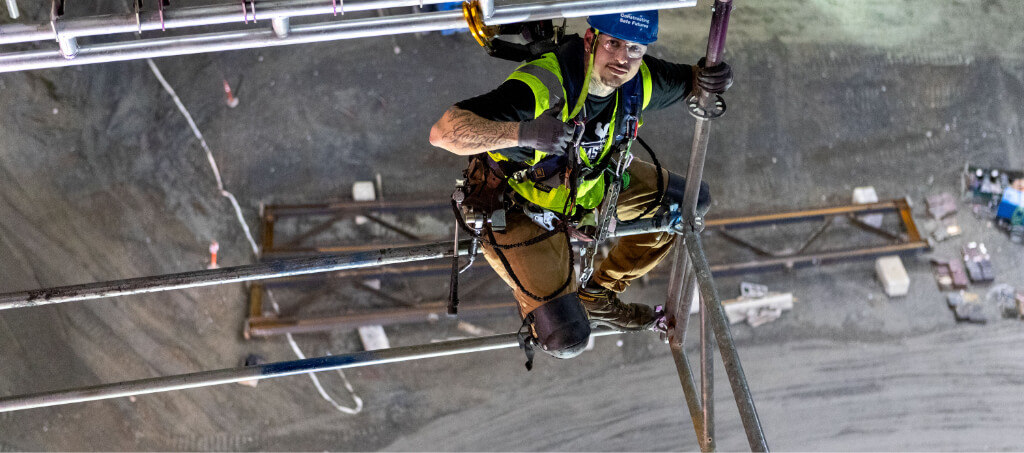 image of man setting up scaffolding